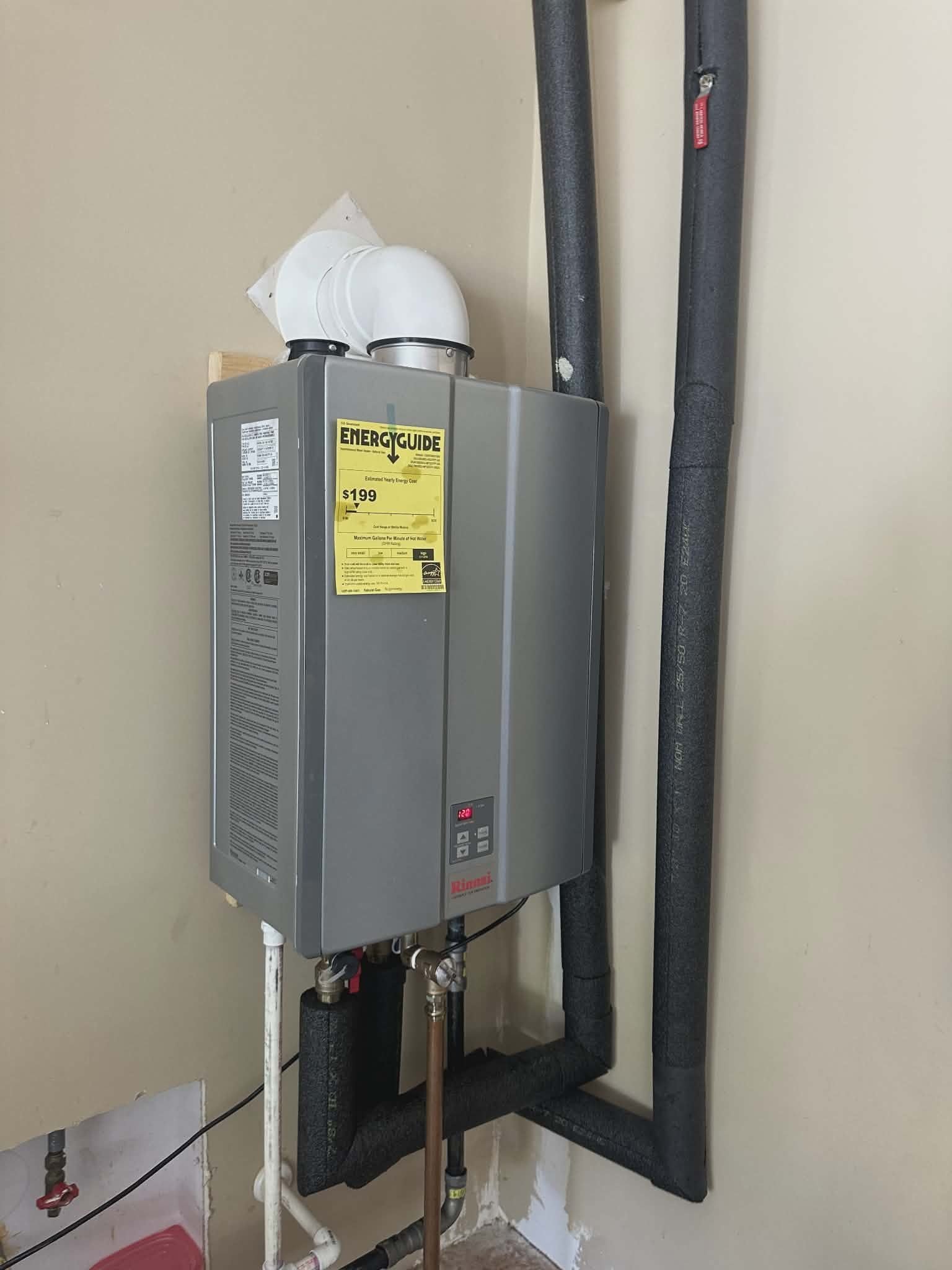 Wall-mounted tankless water heater installed in a Yadkinville home