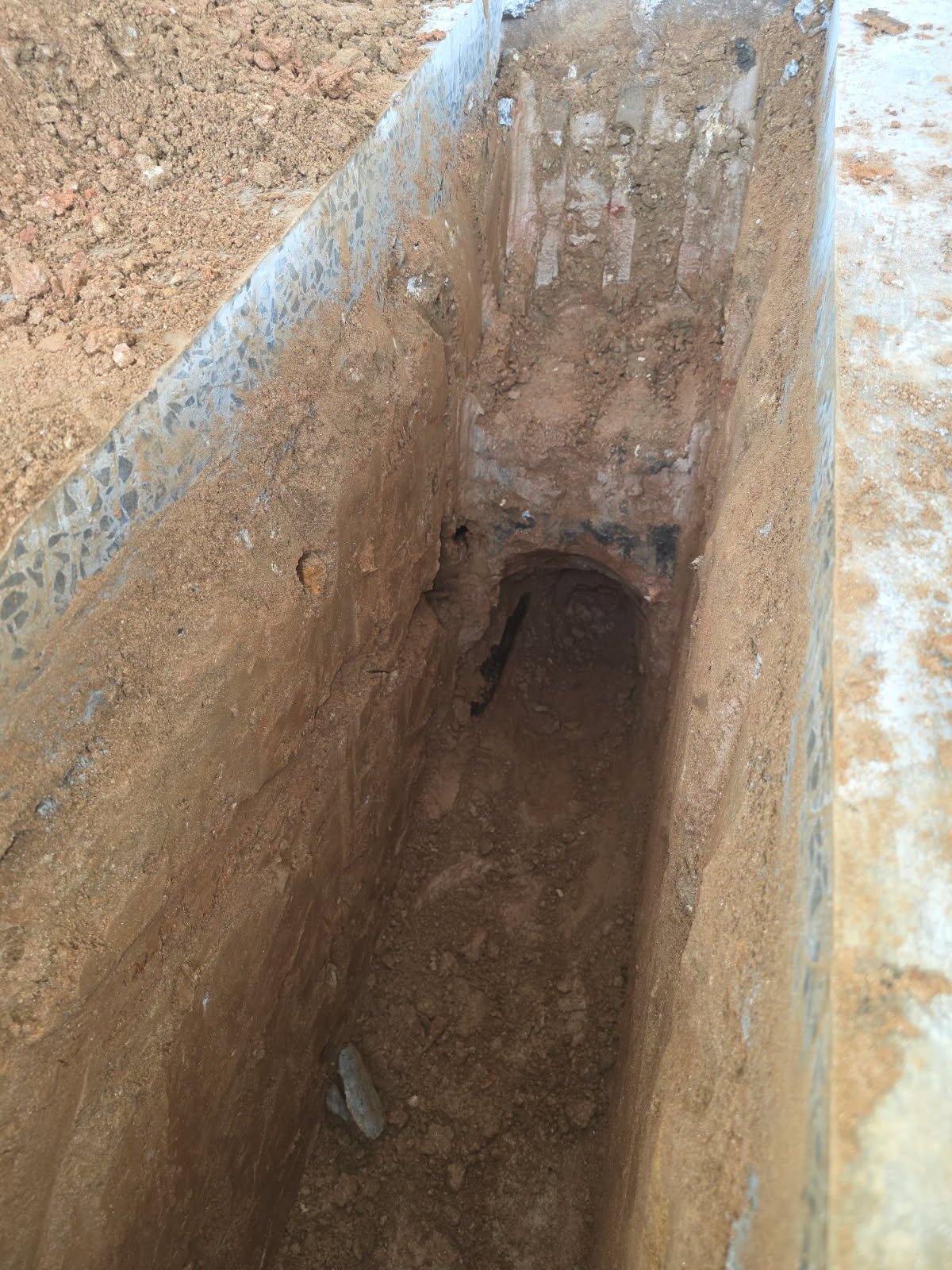 Interior slab area prepped for underground plumbing runs before concrete pour at a Yadkinville commercial gym.