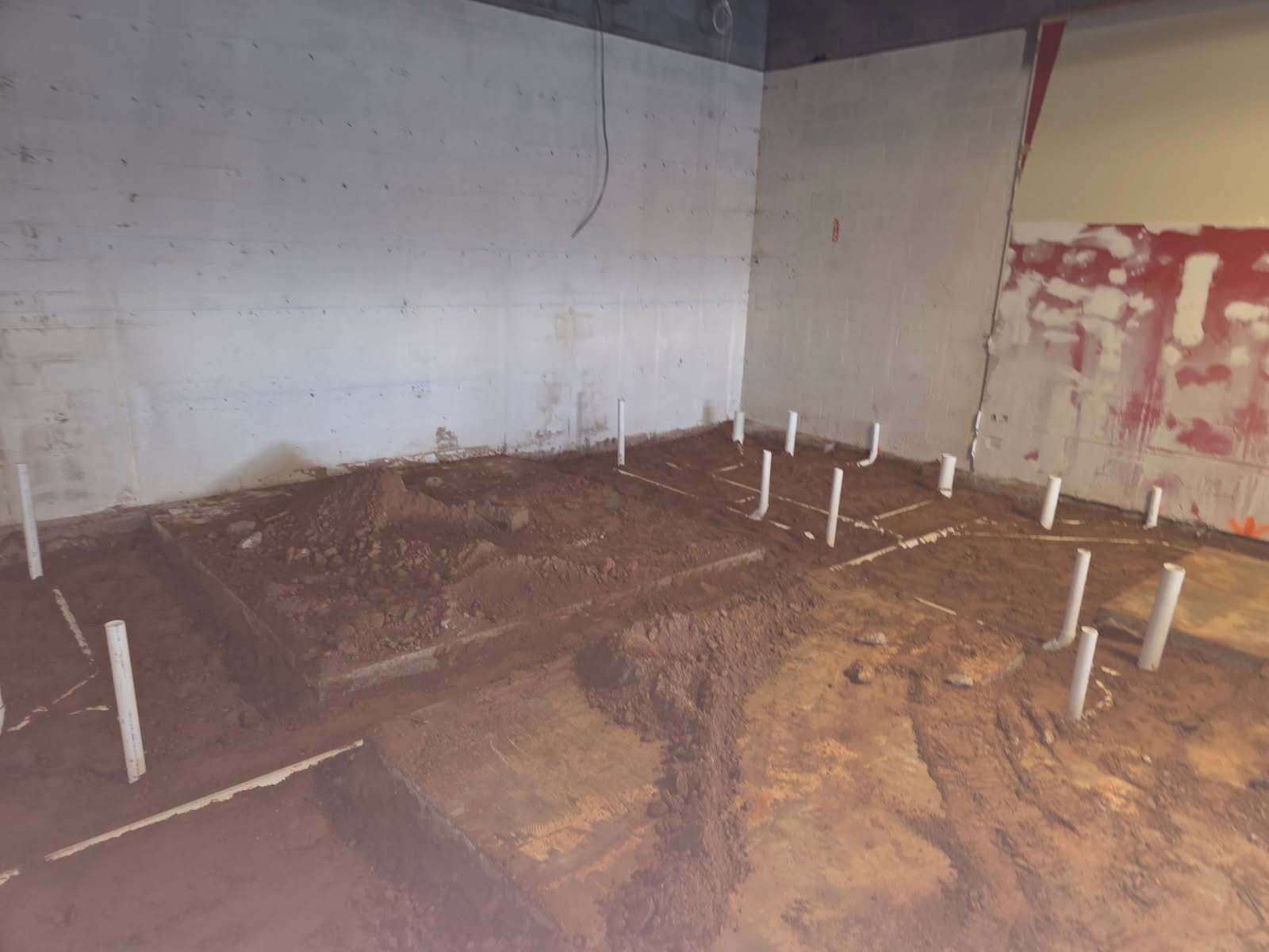 Completed underground plumbing section ready for inspection and next-phase slab or flooring work.