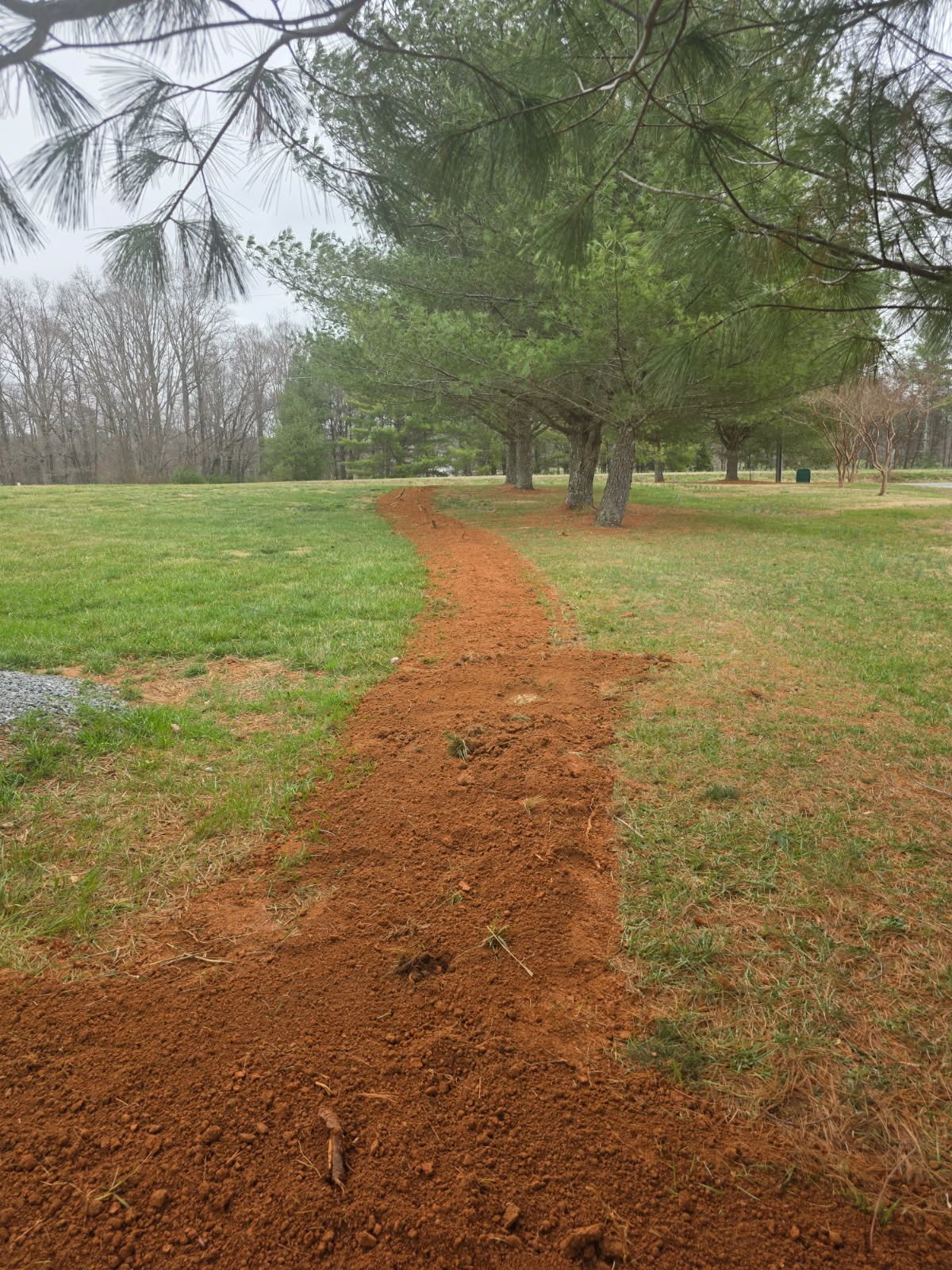 Finished surface area after underground pipeline concealment, ready for landscaping or hardscaping.
