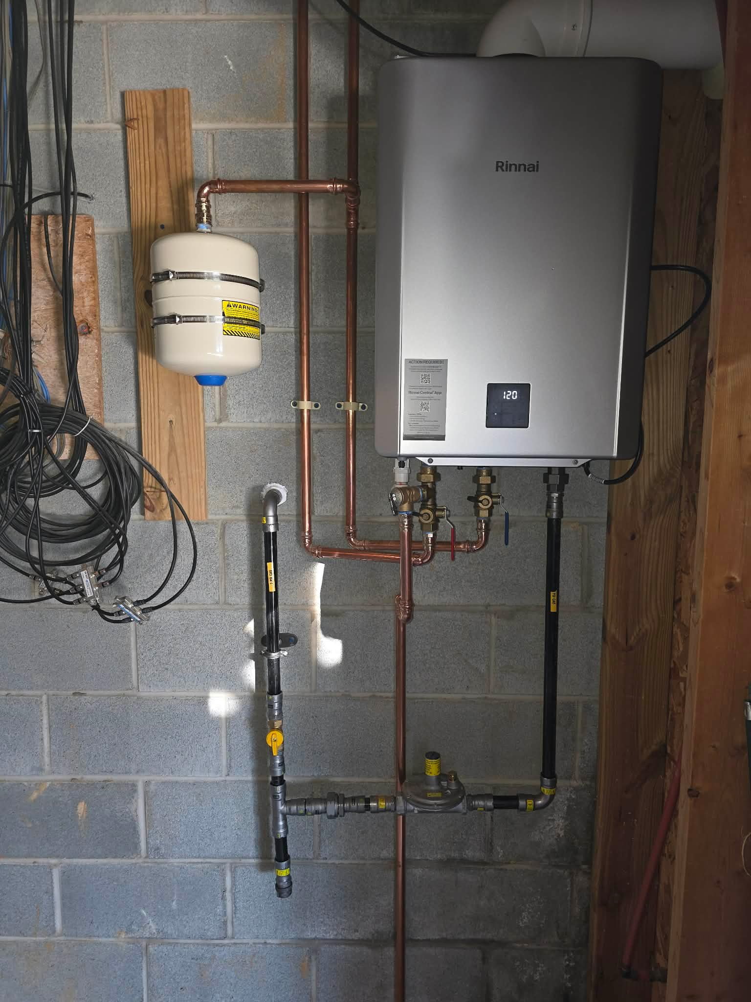 Int Tankless Water Heater 1 plumbing work photo by Burcham's Plumbing